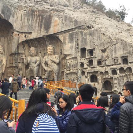 Students were visiting Longmen Grottoes.