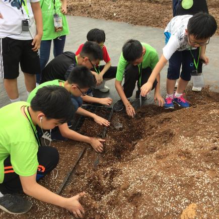 Students were participating in farming activities.